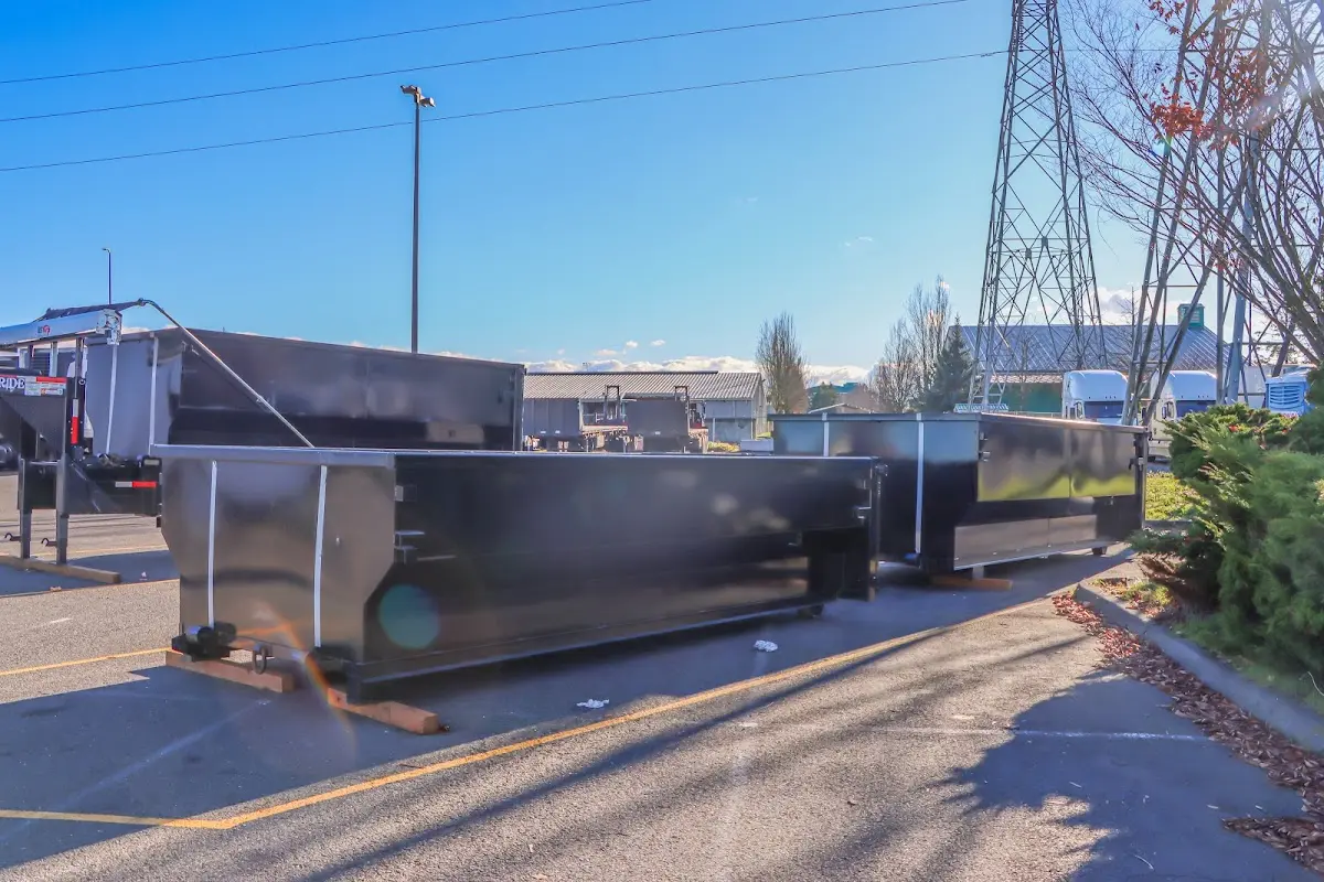 Roll-off dumpster ready for waste disposal at job site for Concrete Dumpster Rental in Great Bend